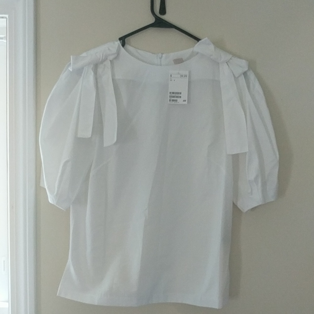 White blouse with bow details